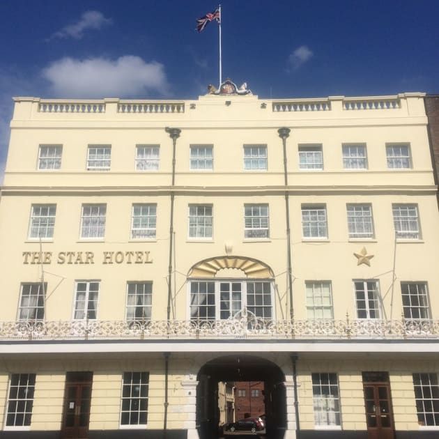 The star hotel has a flag on top of it