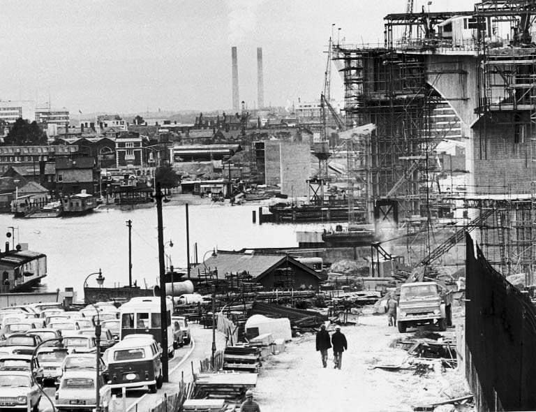 A black and white photo of a city under construction