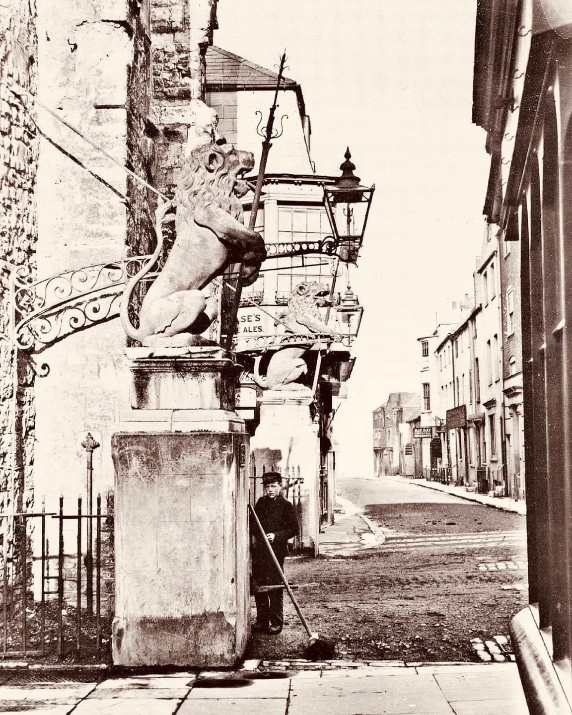 A black and white photo of a statue of a lion