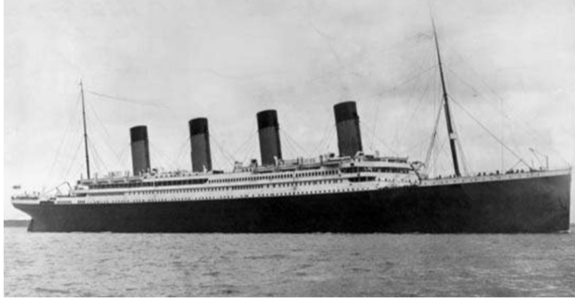 A black and white photo of a large ship in the ocean