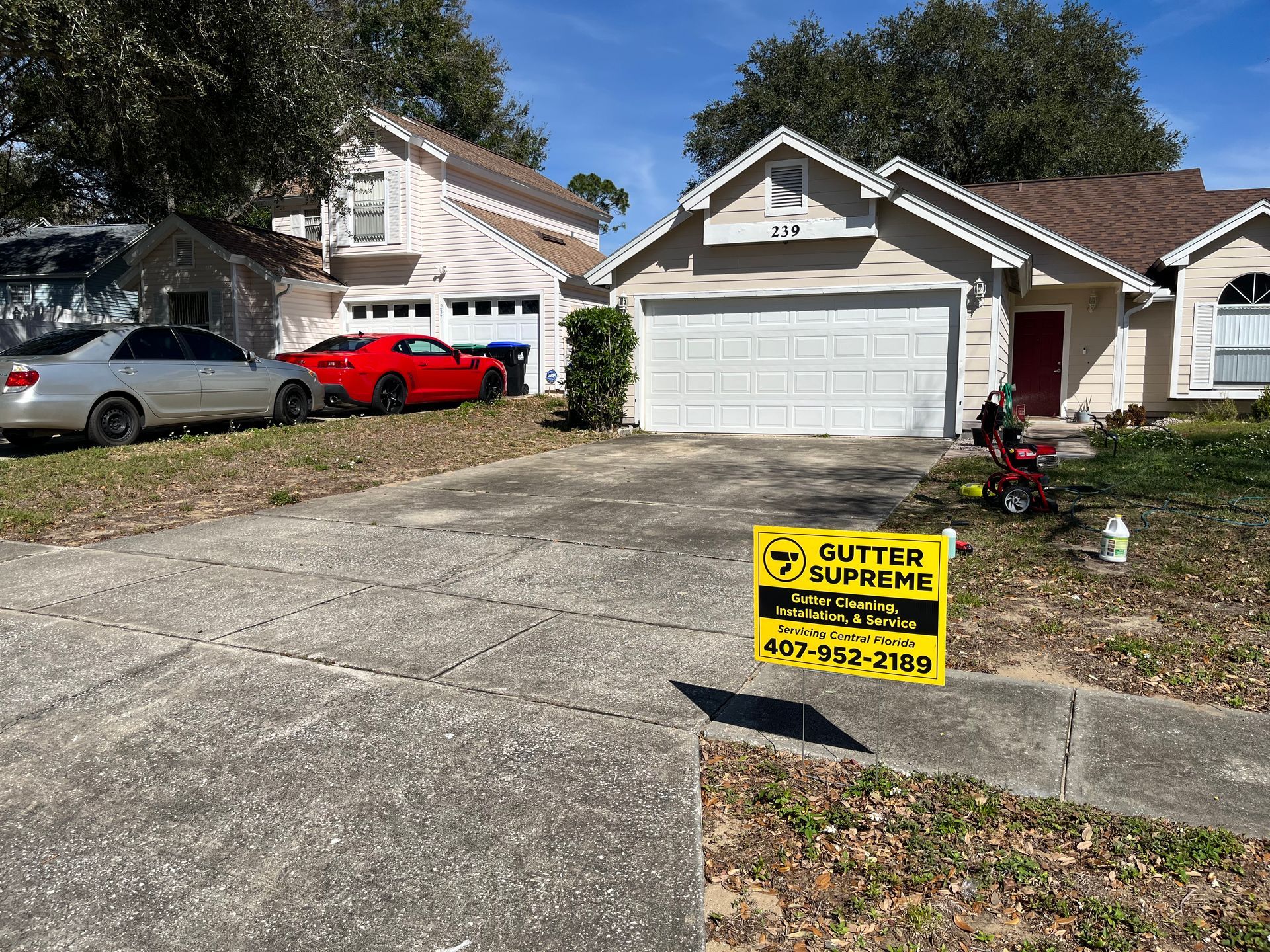A house with a yellow sign in front of it.
