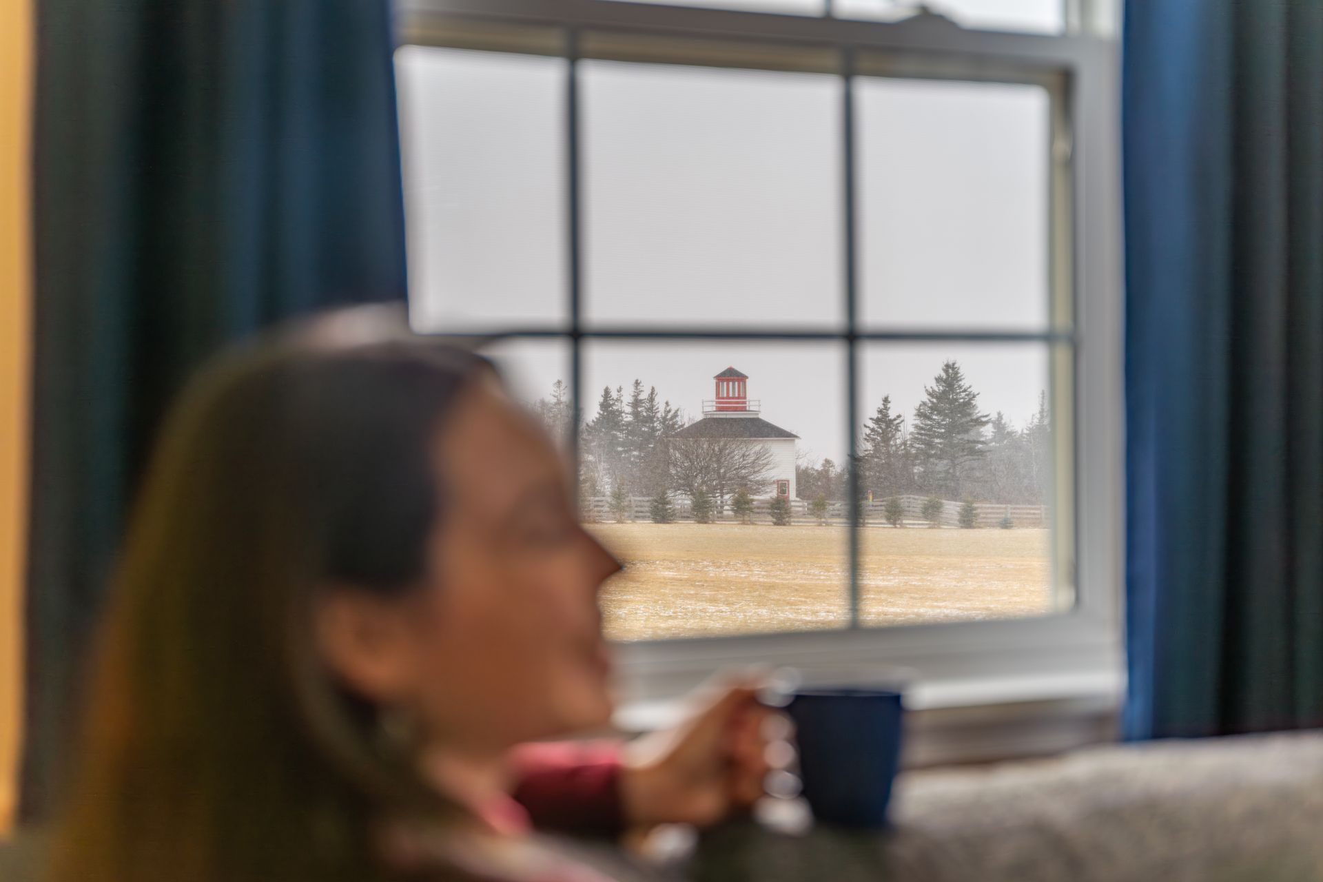 living area with windows over looking the bay of fundy