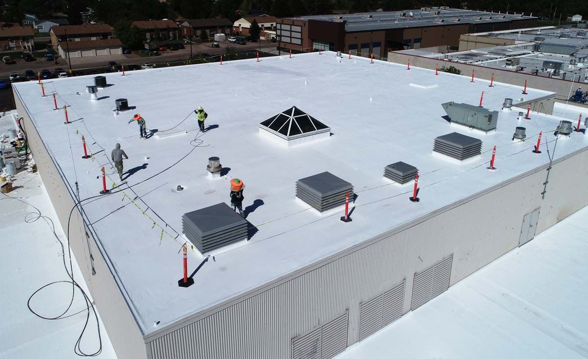 Workers On Commercial Roof — Cheyenne, WY — Inman Roofing