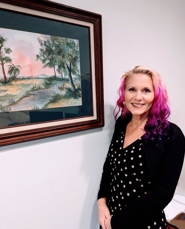 Light blue silhouette of a person, facing forward, from the chest up.