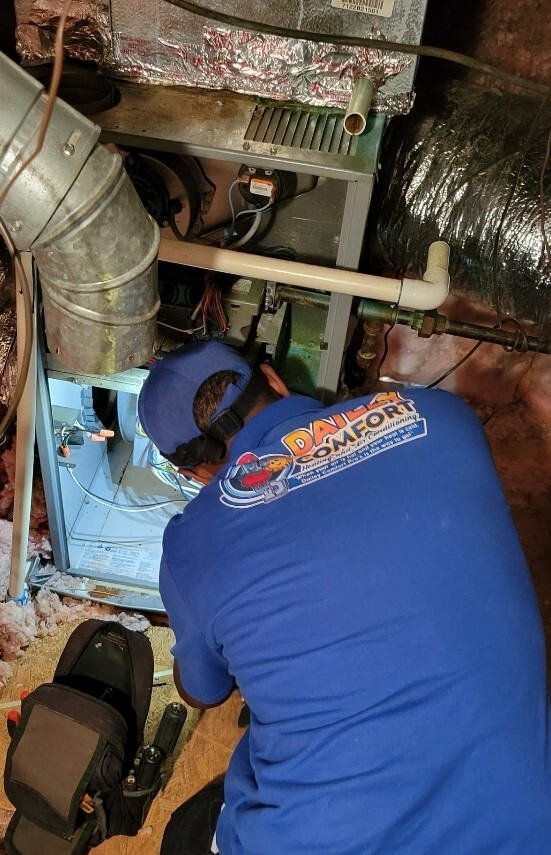 a worker inspecting the vent