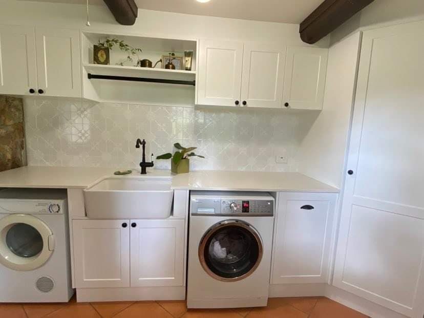 A Bright, White Laundry Room With a Farmhouse Sink — Craftsmen Kitchens In Monkland, QLD