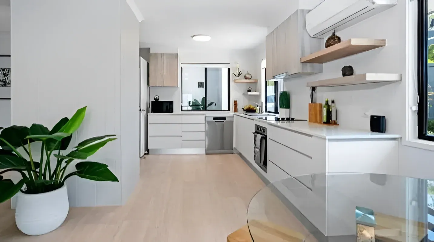 Modern Kitchen With White Cabinets, Light Wood Accents — Craftsmen Kitchens in Monkland, Qld