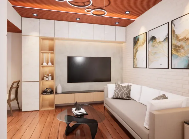 Living room with a sofa, TV, built-in storage, artwork, and a modern coffee table on a wood floor.