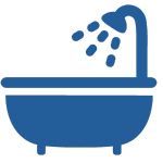 Blue bathtub with showerhead emitting water droplets.