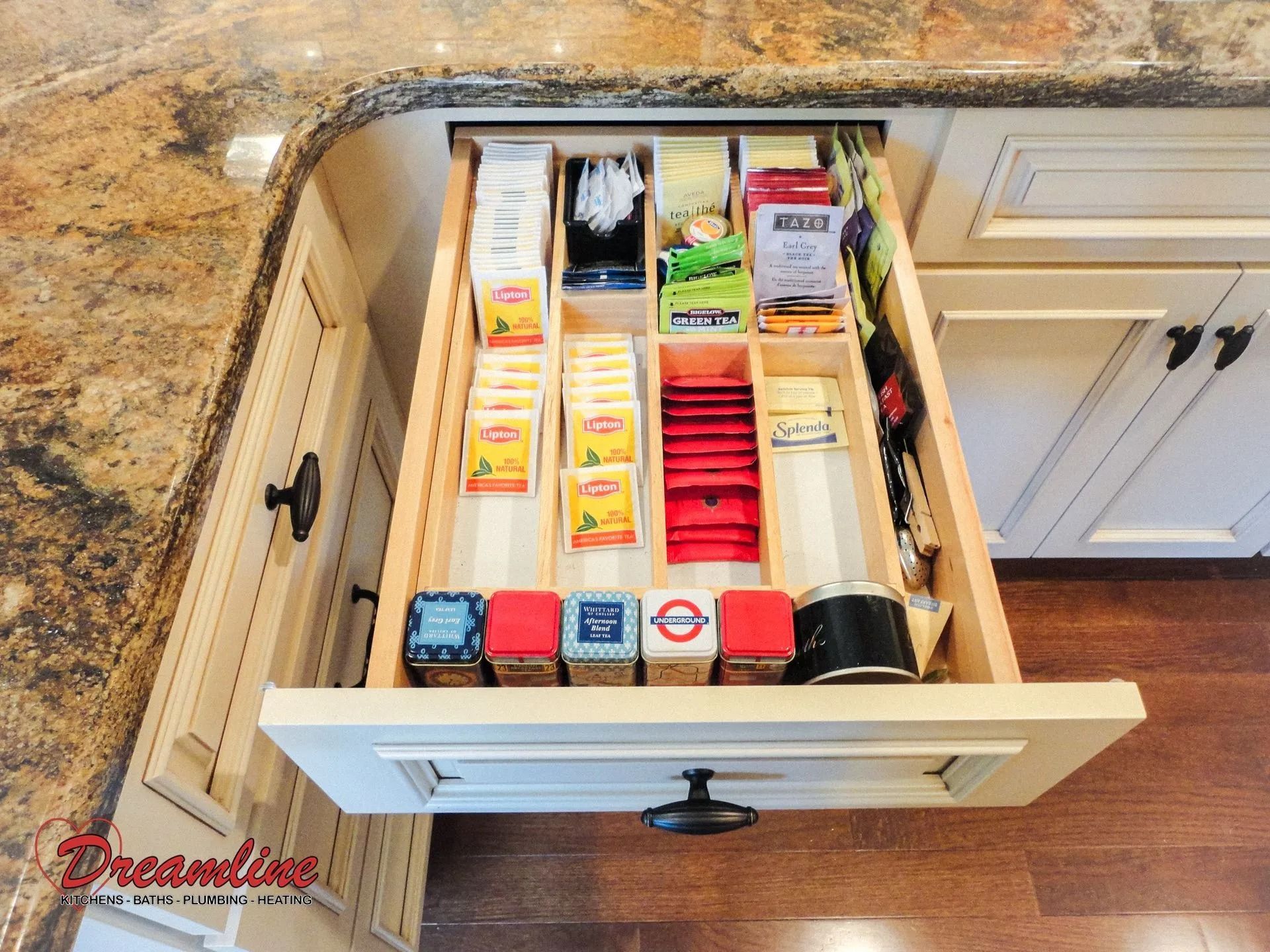 A kitchen drawer filled with various items including tea bags