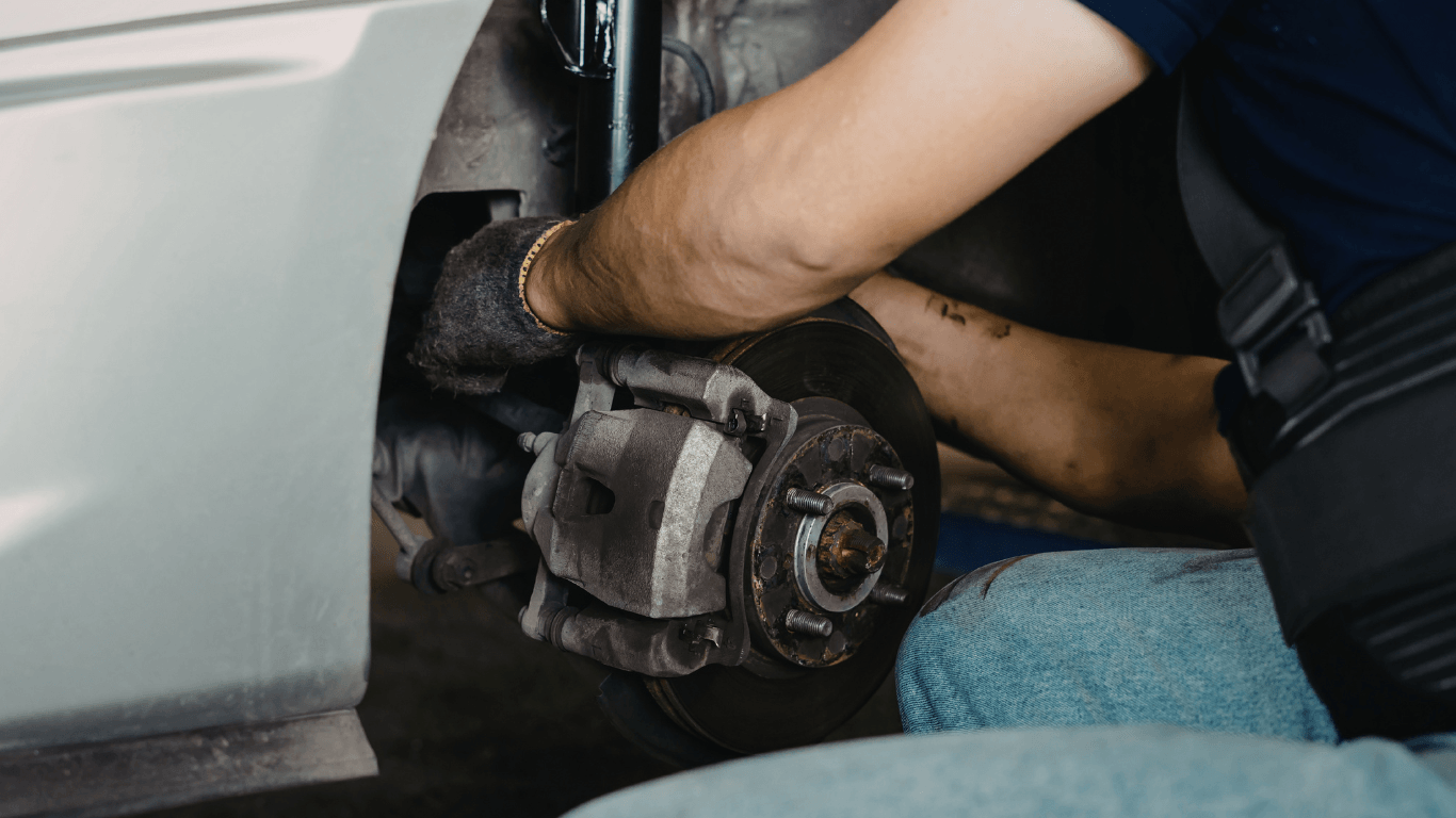 a mechanic doing a brake repair in West Palm Beach