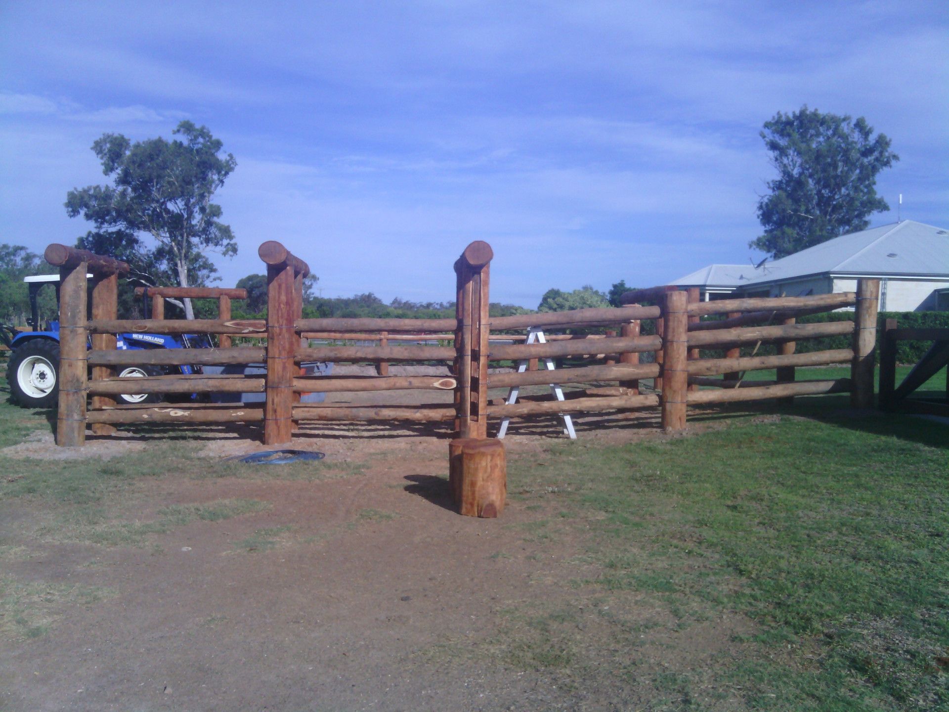 Two Blue Tractors On Farm Land — Mini Excavator Hire & Rural Fencing In Bungundarra, QLD