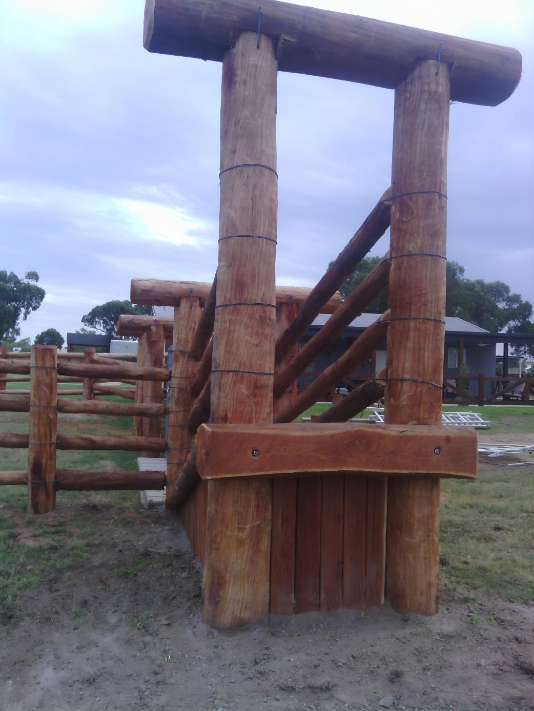 A Wooden Structure With Stairs Made Out Of Logs — Mini Excavator Hire & Rural Fencing In Bungundarra, QLD