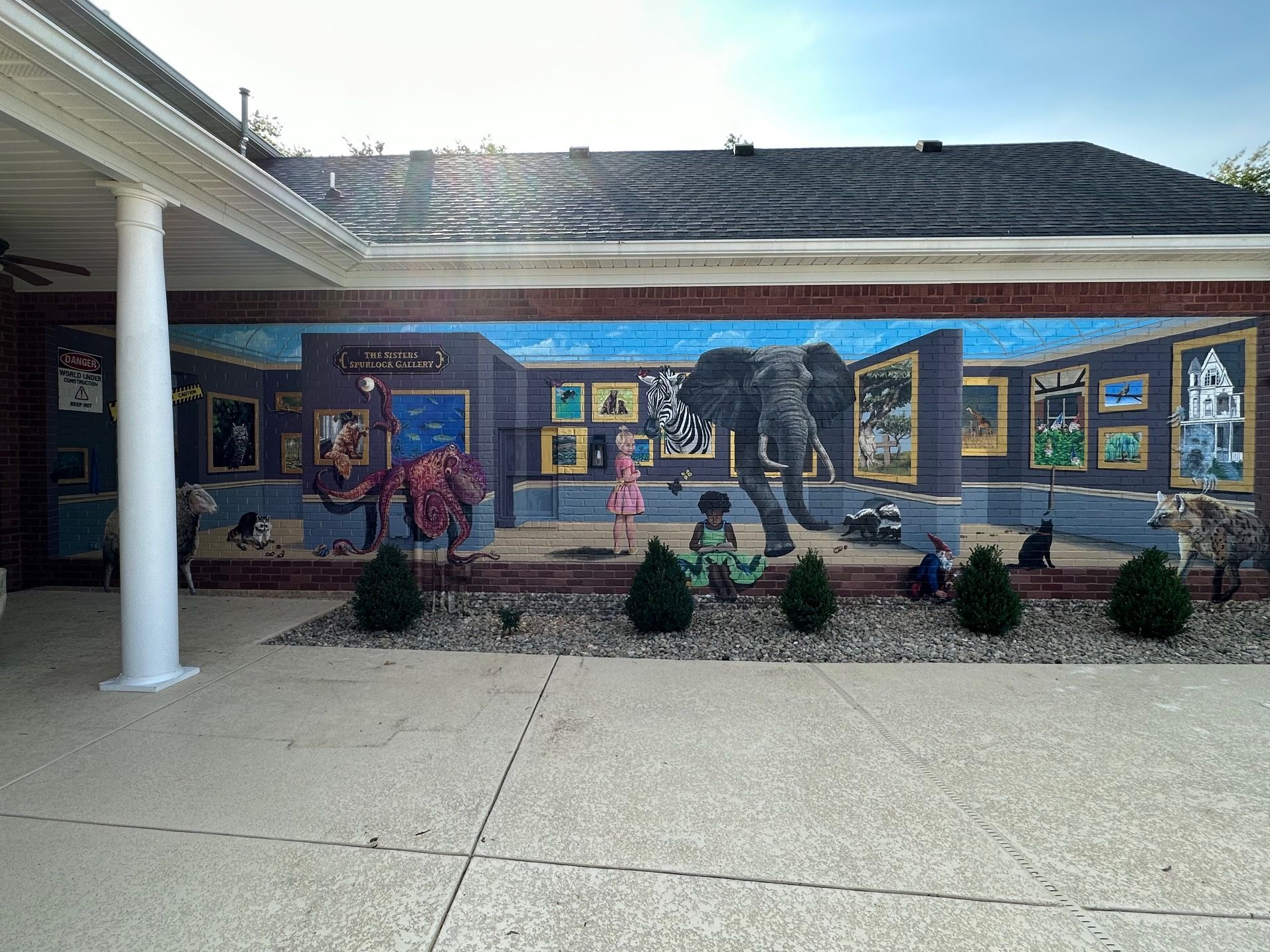 After Painting Characters in Her Books Painted on This Exterior Brick Wall - Exterior and Residential Mural Art