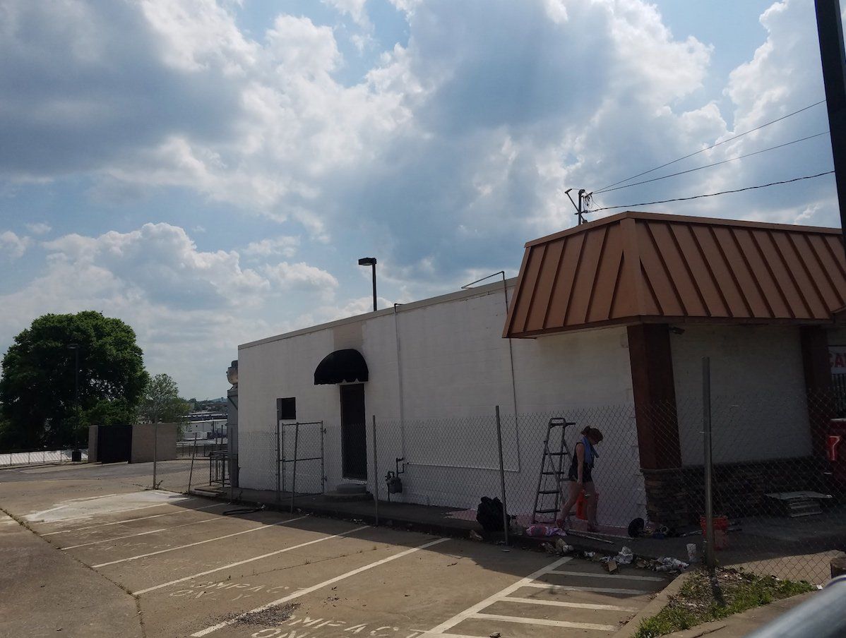 Mural Artist Paints Shooter's Storefront in Nashville TN by Murals & More