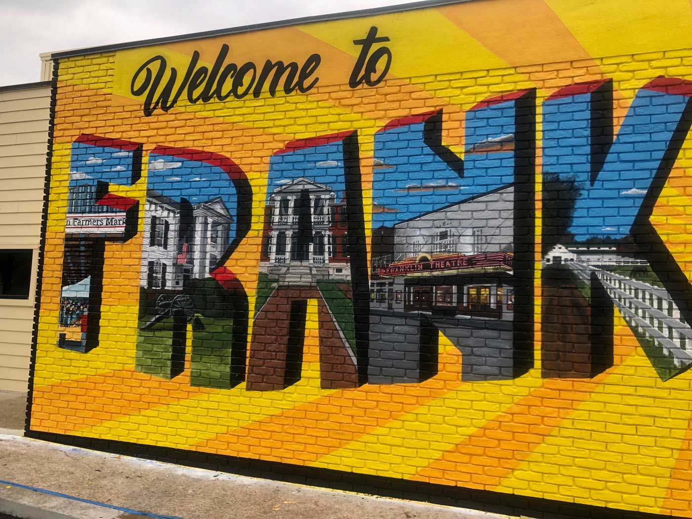 welcome to franklin tn custom exterior mural art tourist attraction after image left side