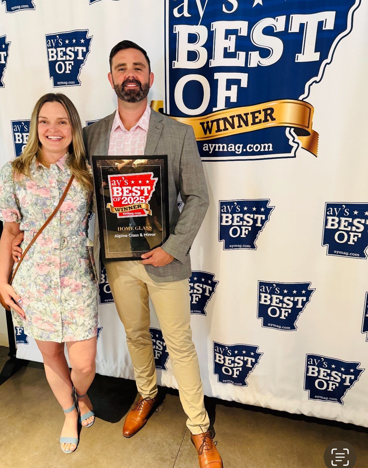 Alpine Glass & Window's owner, Mike, holding the AY's Best of 2025 award.