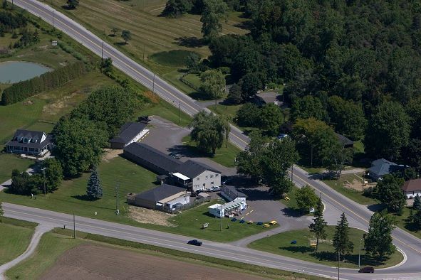 An aerial view of a small town with houses and trees
