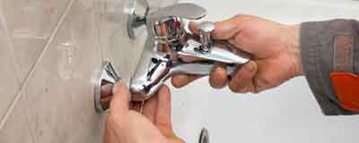Toilet Repair - Plumber Holding Bathroom Sink in Watsonville, CA