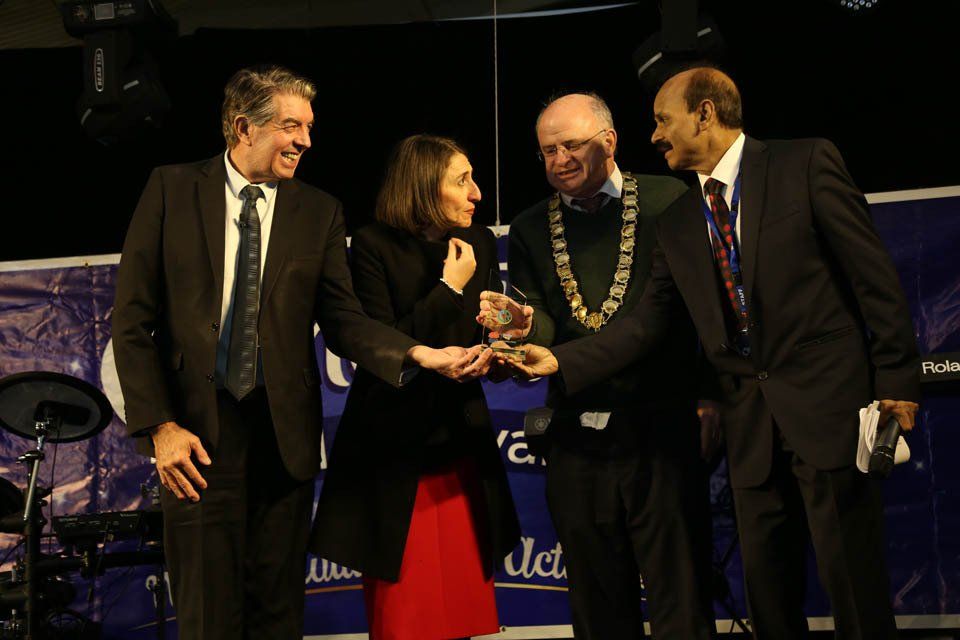 A group of people in suits are standing next to each other