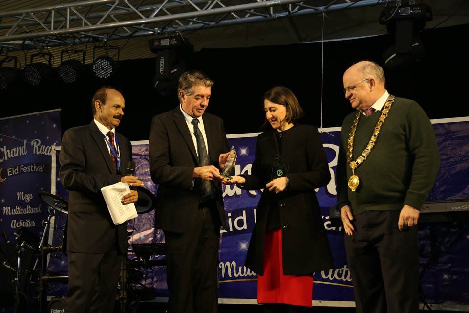 A group of people standing in front of a sign that says ' star ' on it