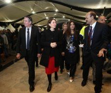 A group of people are walking in a room.