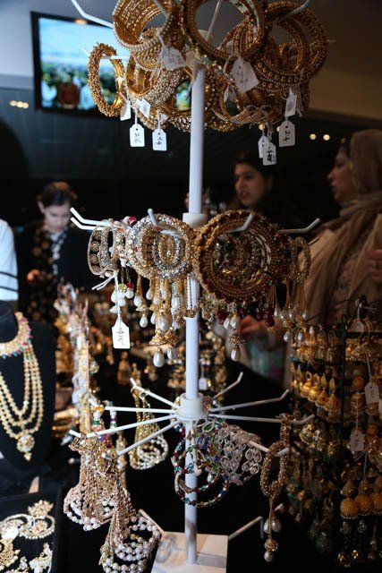 A display of gold jewelry including bracelets and necklaces