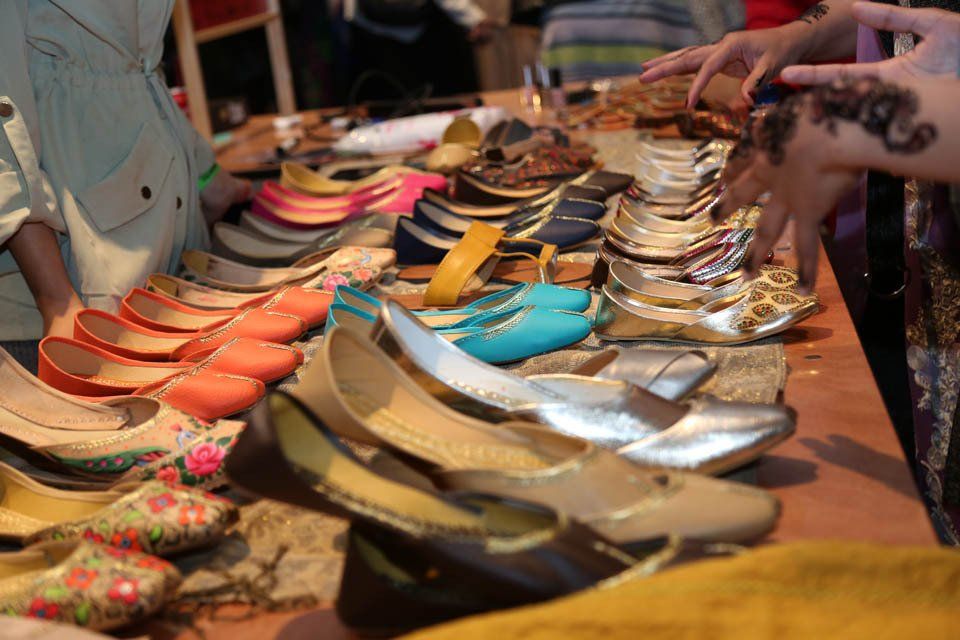 A table with a bunch of shoes on it