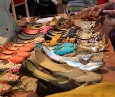 A table with a bunch of shoes on it