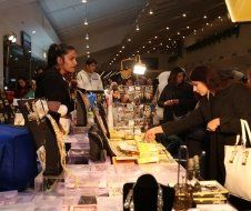 A group of people are shopping at a jewelry store.