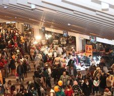 A large crowd of people are gathered in a building.