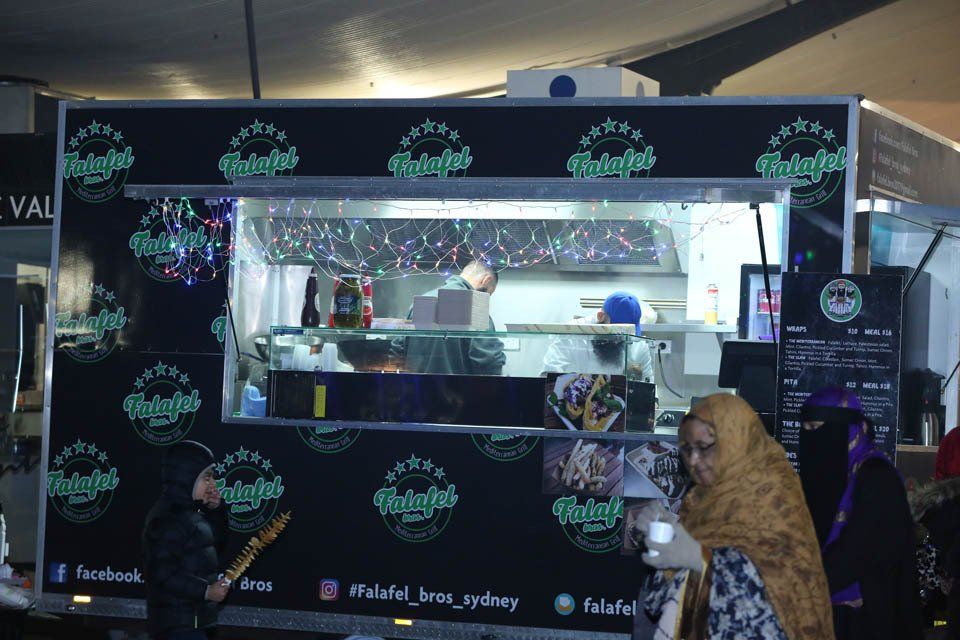 A food truck with the word falafel on it
