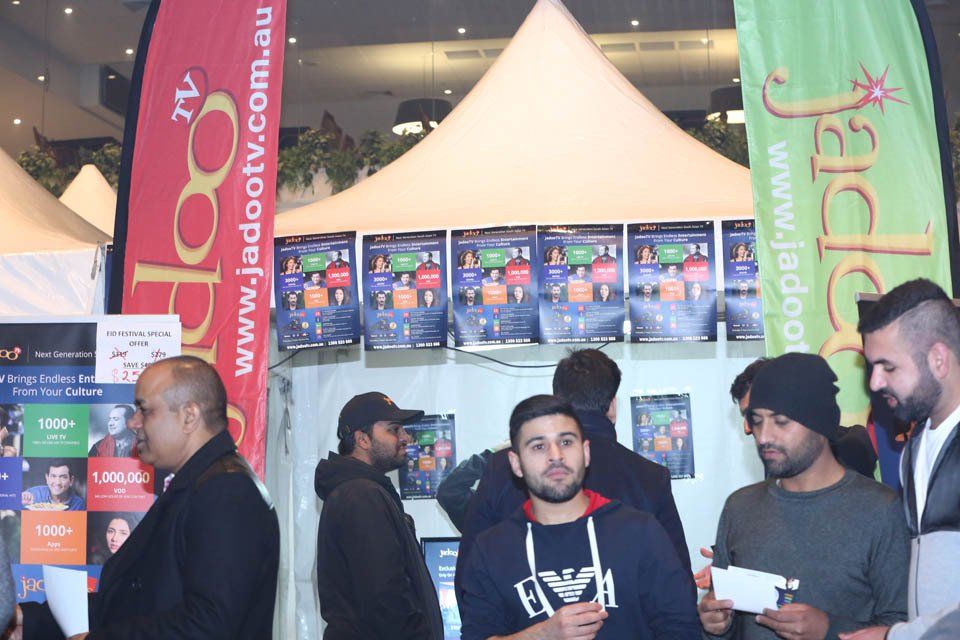 A group of men are standing in front of a banner that says jadaotv.com.au