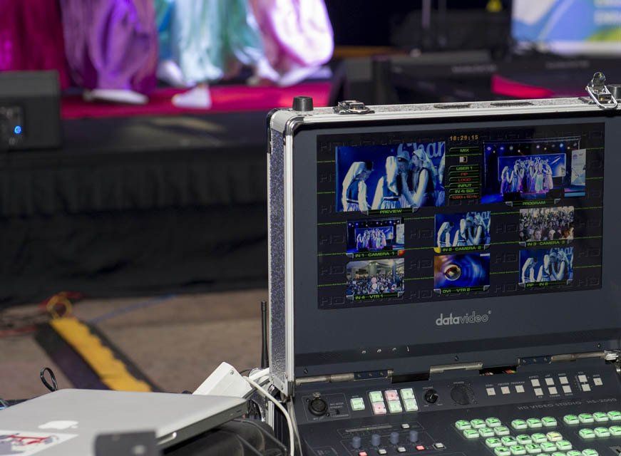 A laptop is sitting on a table next to a monitor that says ' dateview ' on it
