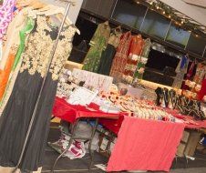 A store filled with lots of clothes and jewelry.