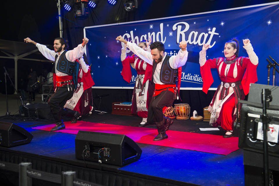 A group of people are dancing on a stage.