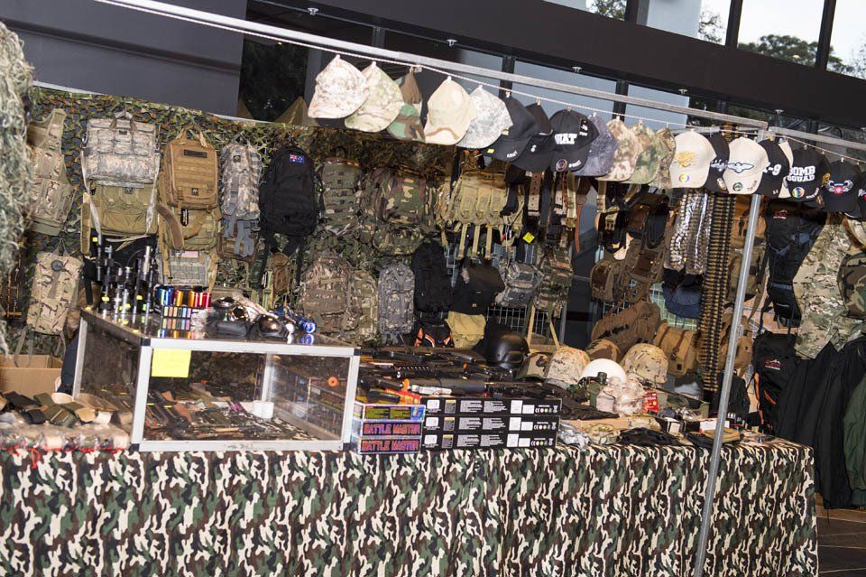 A table with a lot of military items on it