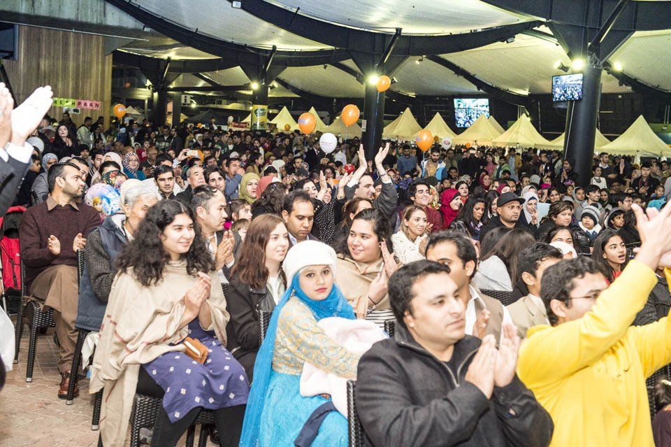 A large group of people are sitting in a room.