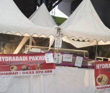 A tent with a sign that says hydrabadi pakwa on it