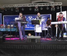 A group of people are playing instruments on a stage.