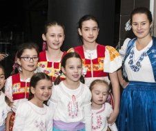 A group of young girls are posing for a picture together.