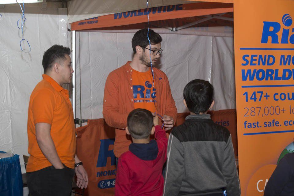 A group of people standing in front of a sign that says send me worldwide