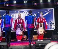 A group of people are dancing on a stage.
