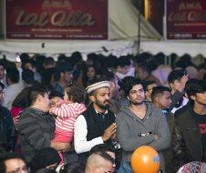 A large group of people are standing in a crowd.