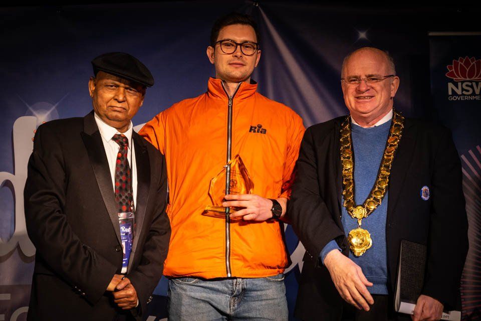 A man in an orange jacket with the word life on it
