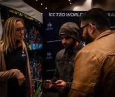 A man and a woman are talking to each other in a room.