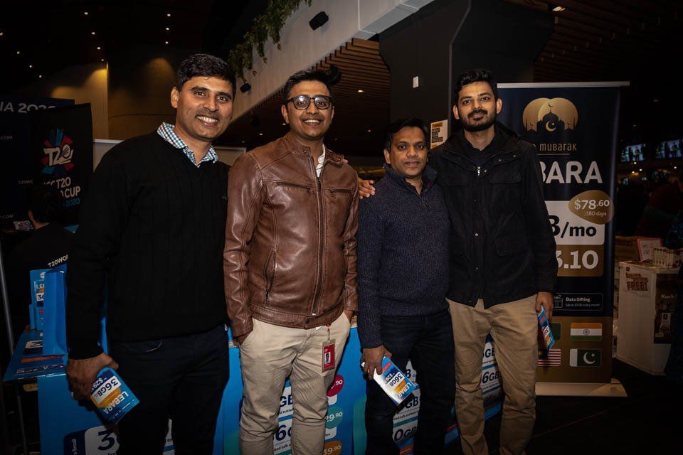 A group of men are posing for a picture together.