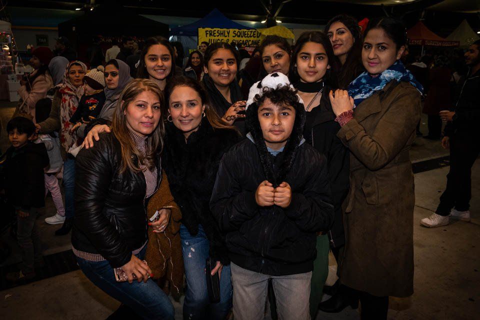 A group of people are posing for a picture together.