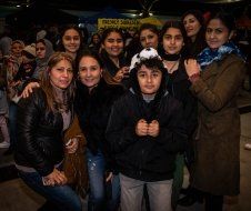 A group of people are posing for a picture together.