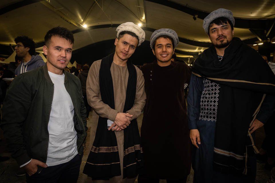 A group of young men are posing for a picture together.